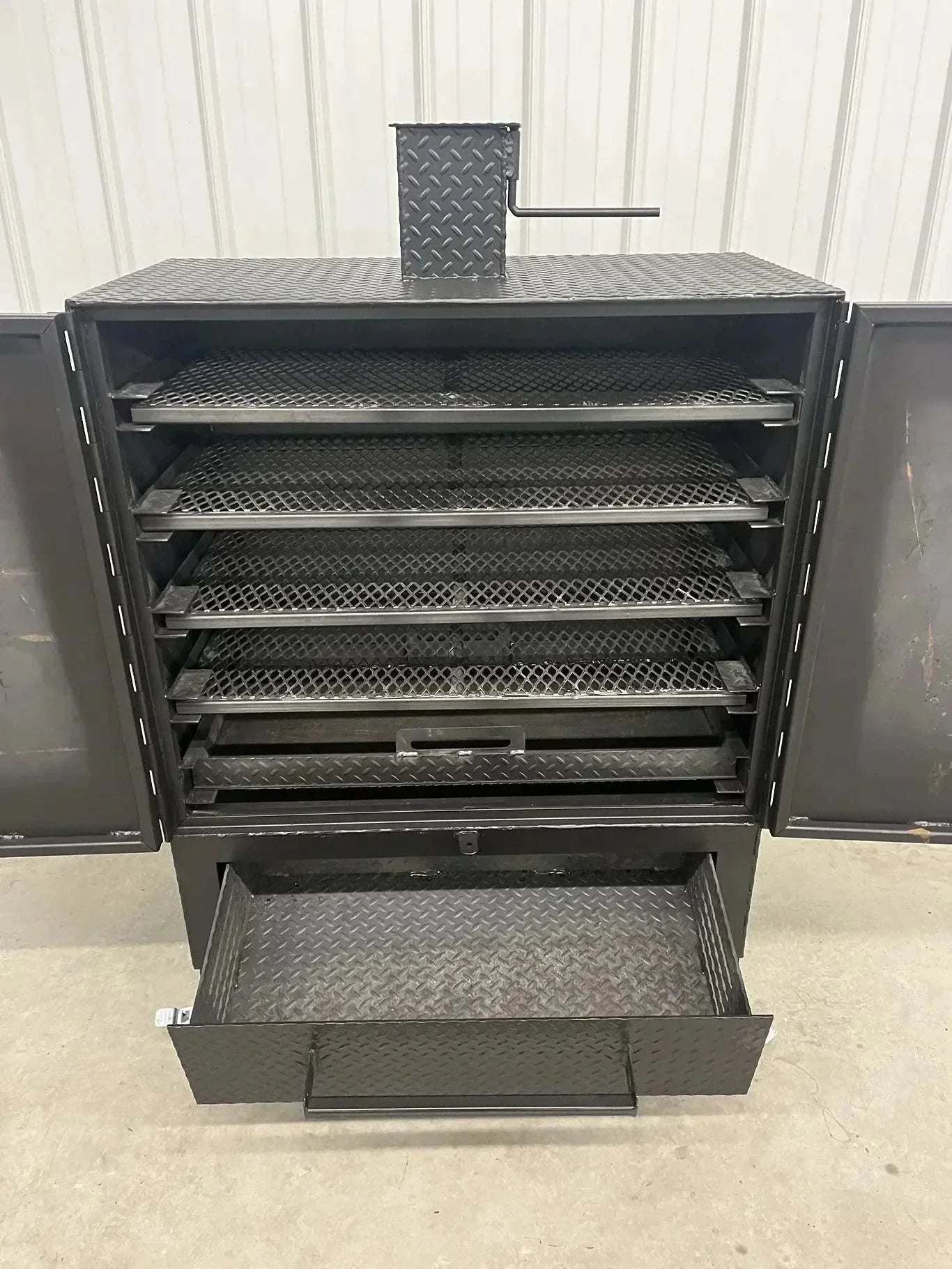 42 Cabinet Combo Smoker with heavy steel construction, multiple racks, and pull-out ash pan for wood and charcoal smoking.