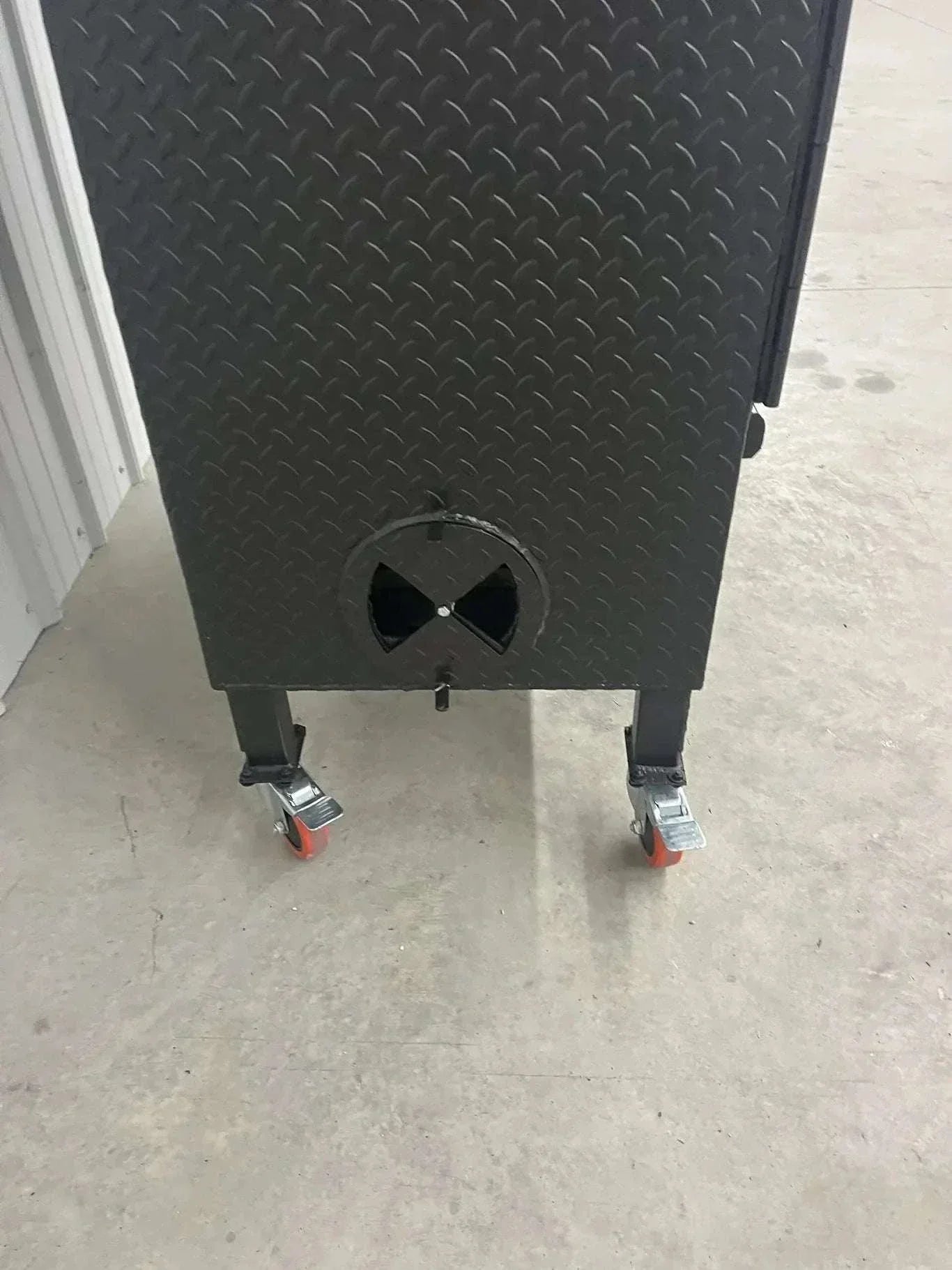 42-inch cabinet combo smoker on caster wheels with textured steel construction for versatile BBQ smoking using wood and charcoal