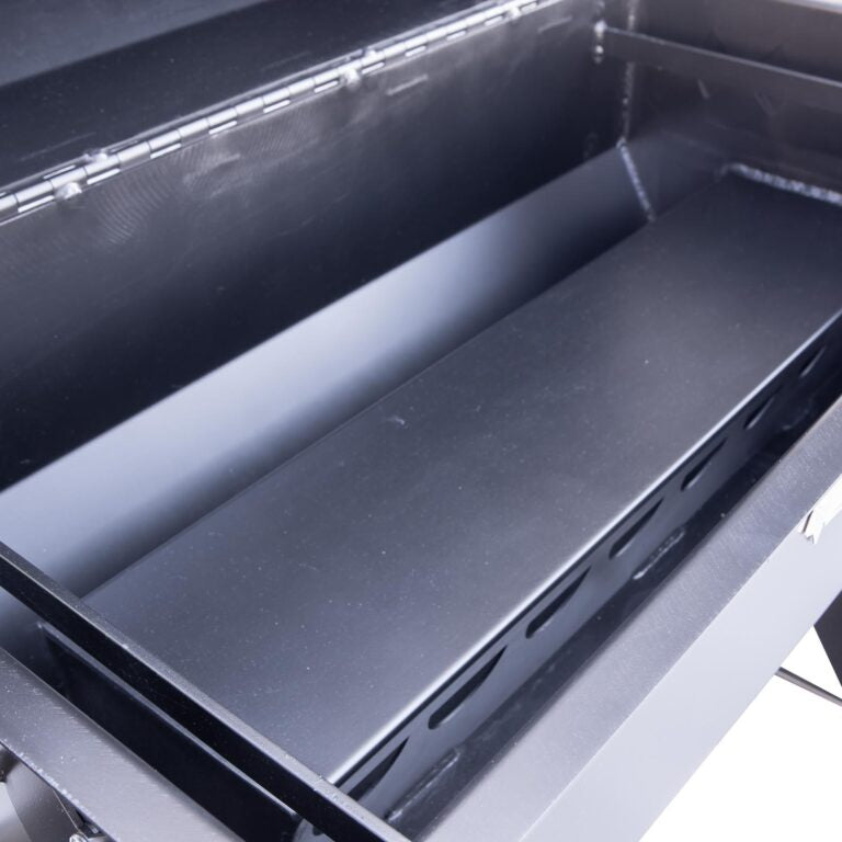 Close-up of a black metal shelf inside a cabinet or storage unit.