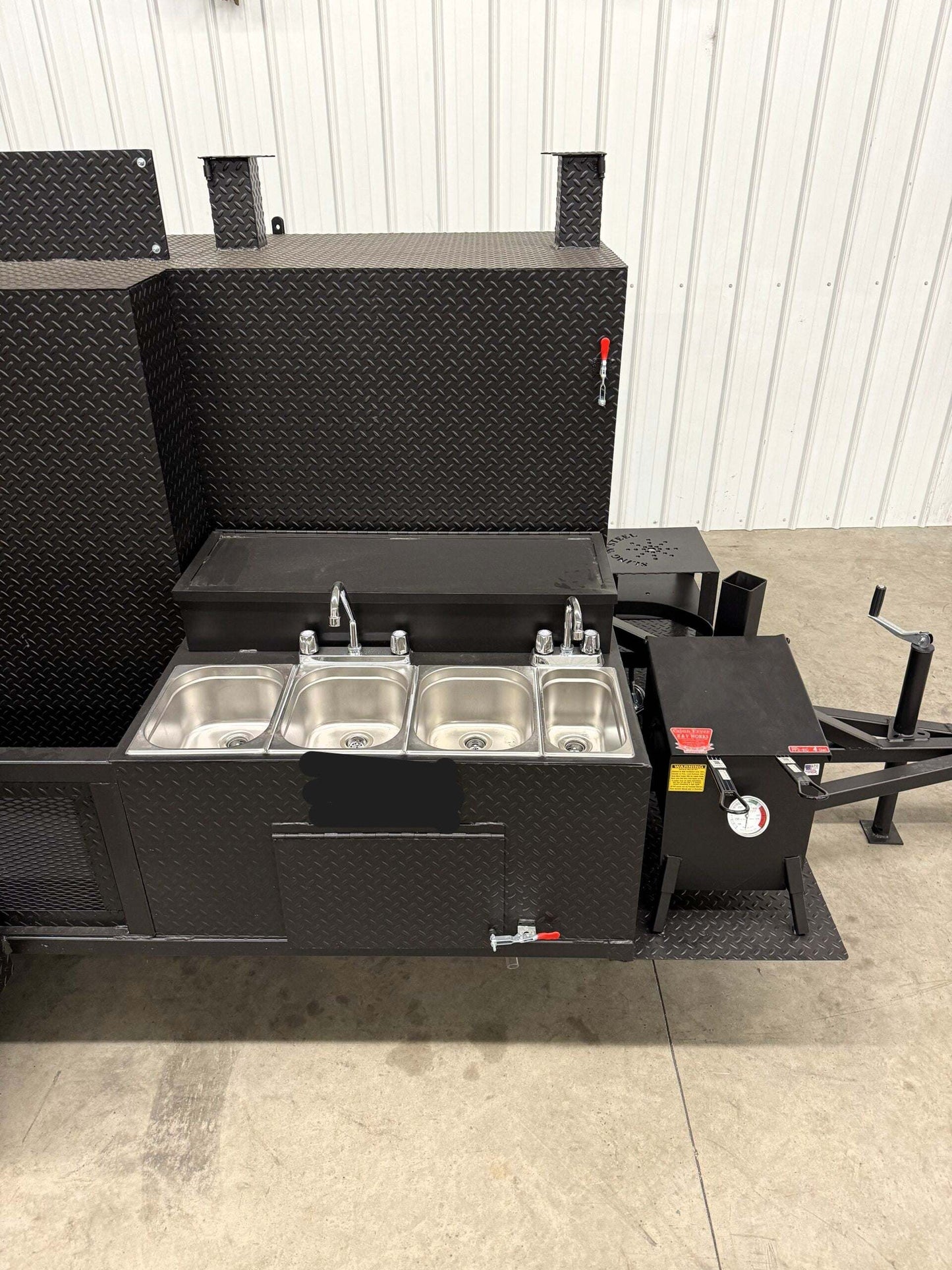 custom charcoal grill and SNS 4060 smoker combo with triple sink and trailer setup for versatile catering use