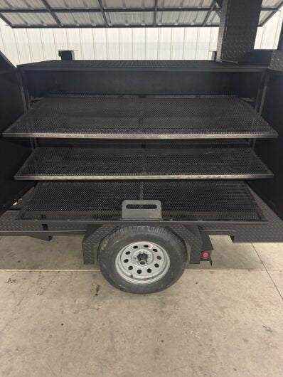 Reverse smoker Ultimate Smokehouse 60 with triple pull-out racks and charcoal tray on trailer base
