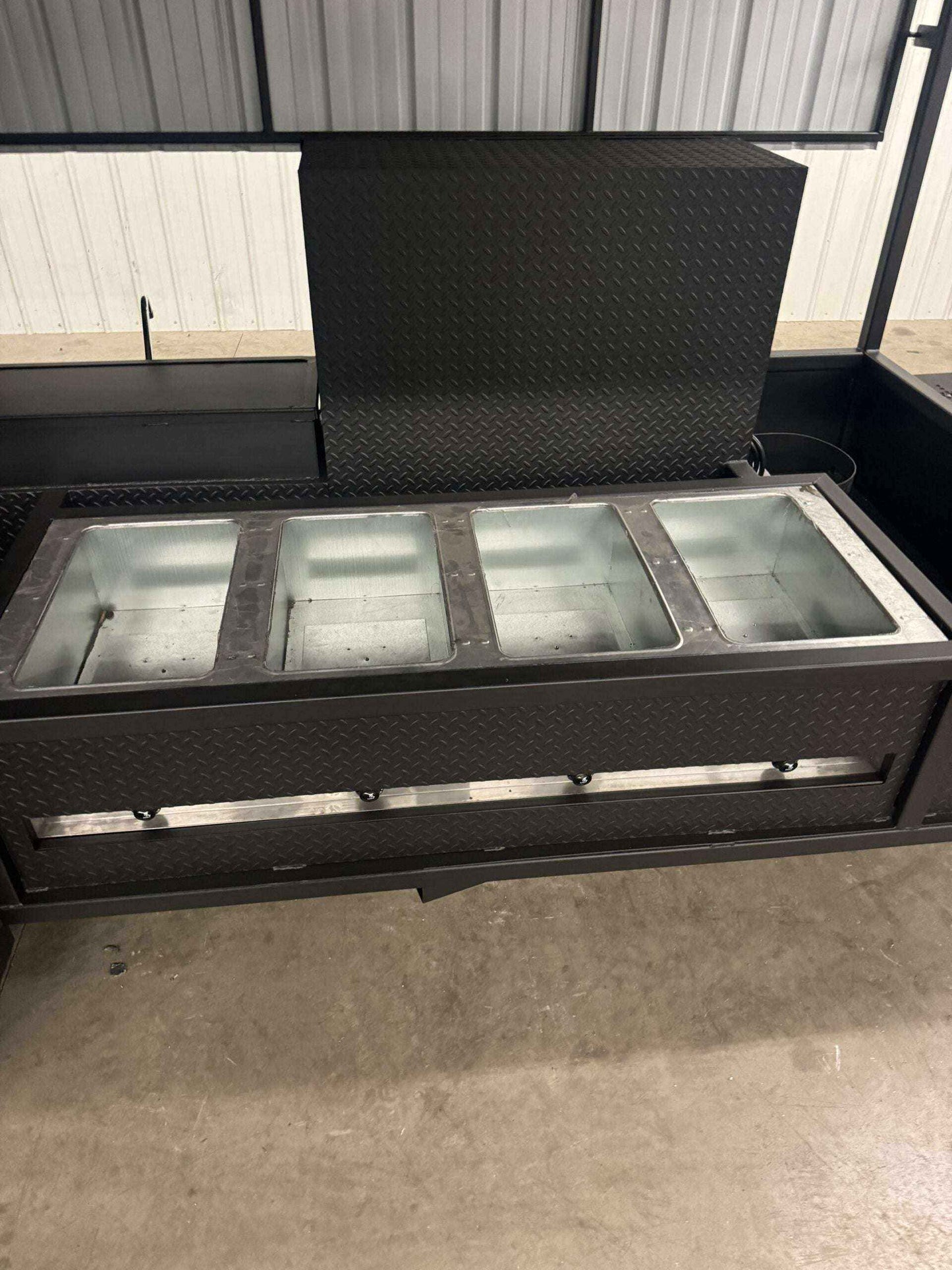 Custom Ultimate Smokehouse 72 commercial smoker with insulated firebox, four-bay sink, 36-inch griddle, pull-out cooking racks, and storage compartments