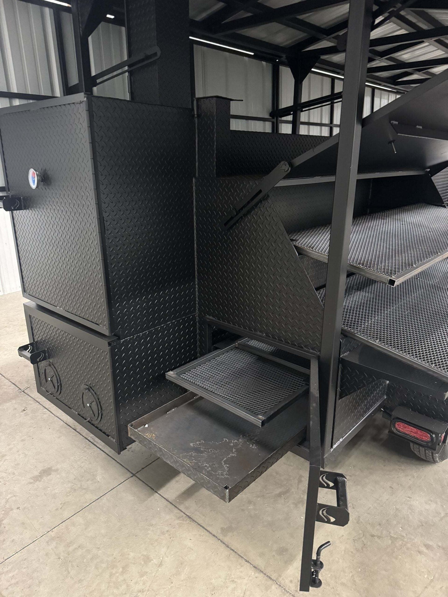 Commercial Smoker Custom Ultimate Smokehouse 72-inch black diamond tread steel smoker with pull-out cooking racks and pullout charcoal tray