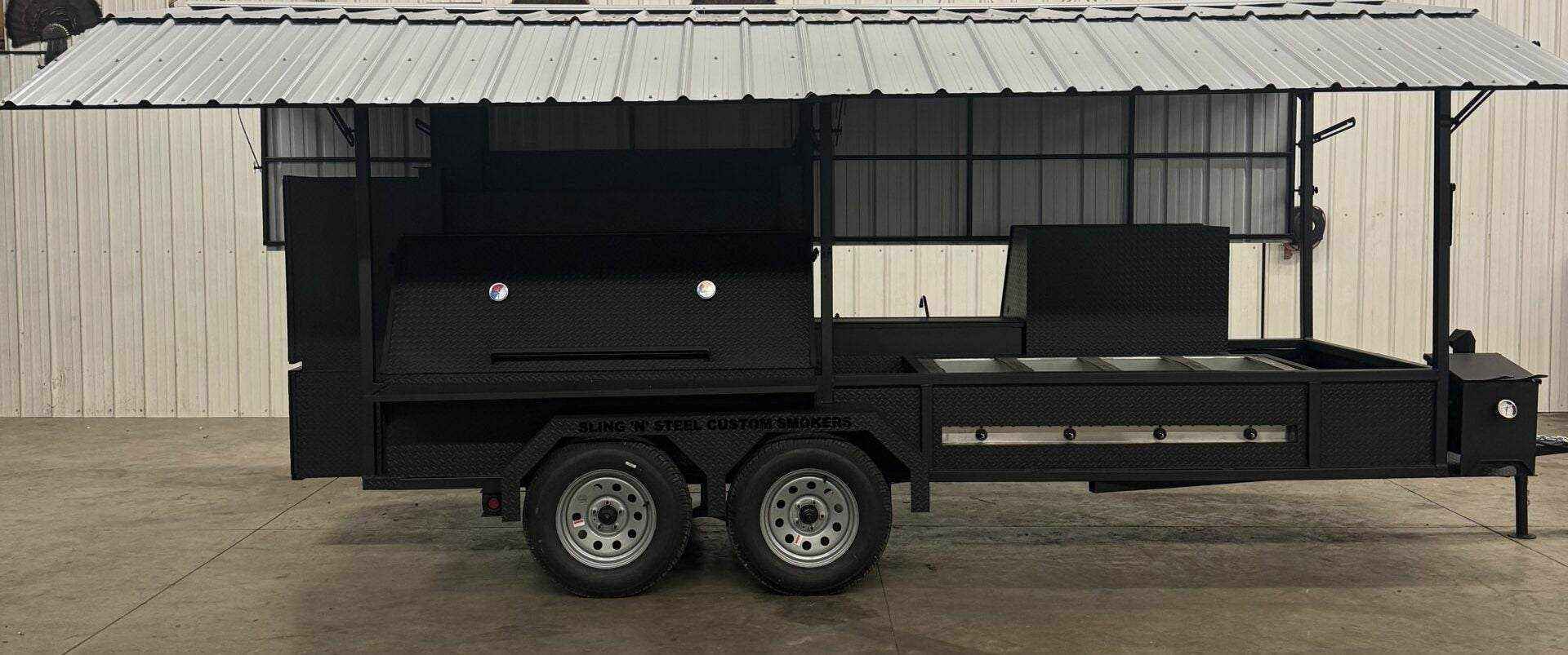 Custom Ultimate Smokehouse 72 commercial smoker trailer with roof, dual cooking chambers, griddle, and sink package