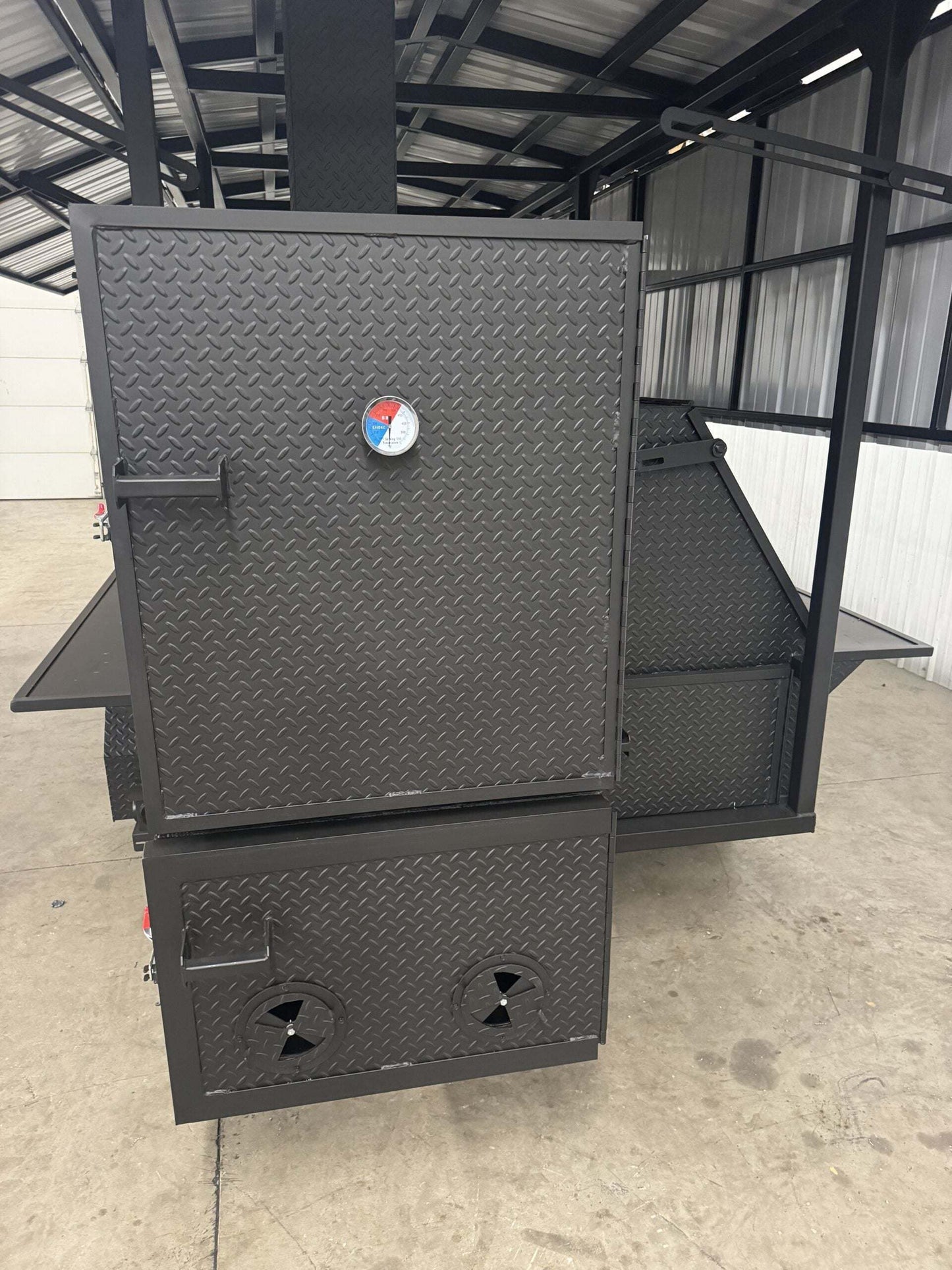 Commercial Smoker Custom Ultimate Smokehouse 72 with griddle, insulated firebox, and reverse flow smoker design in diamond tread steel