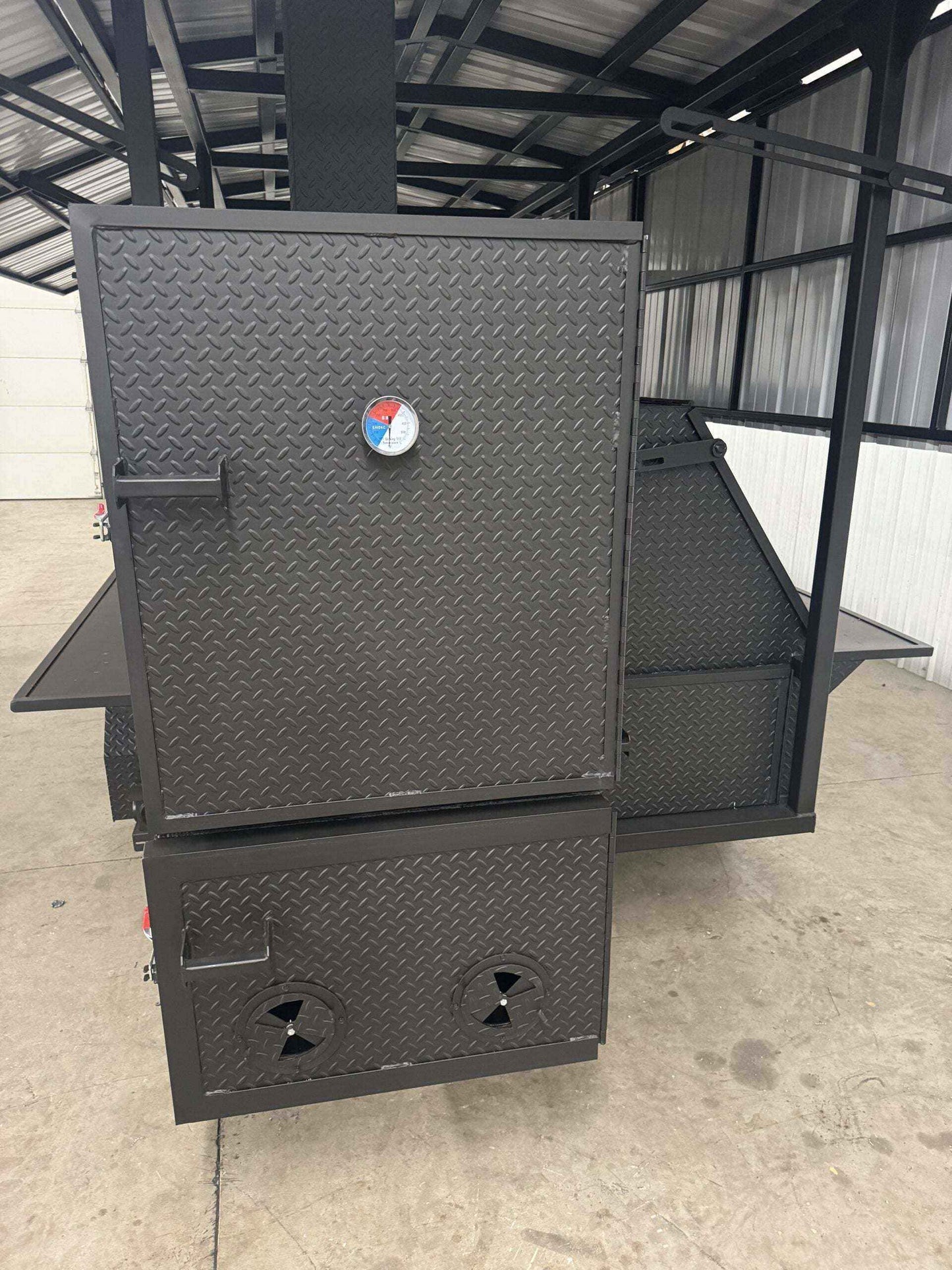 Custom Ultimate Smokehouse 72-inch commercial reverse flow smoker with griddle and double-walled insulated firebox
