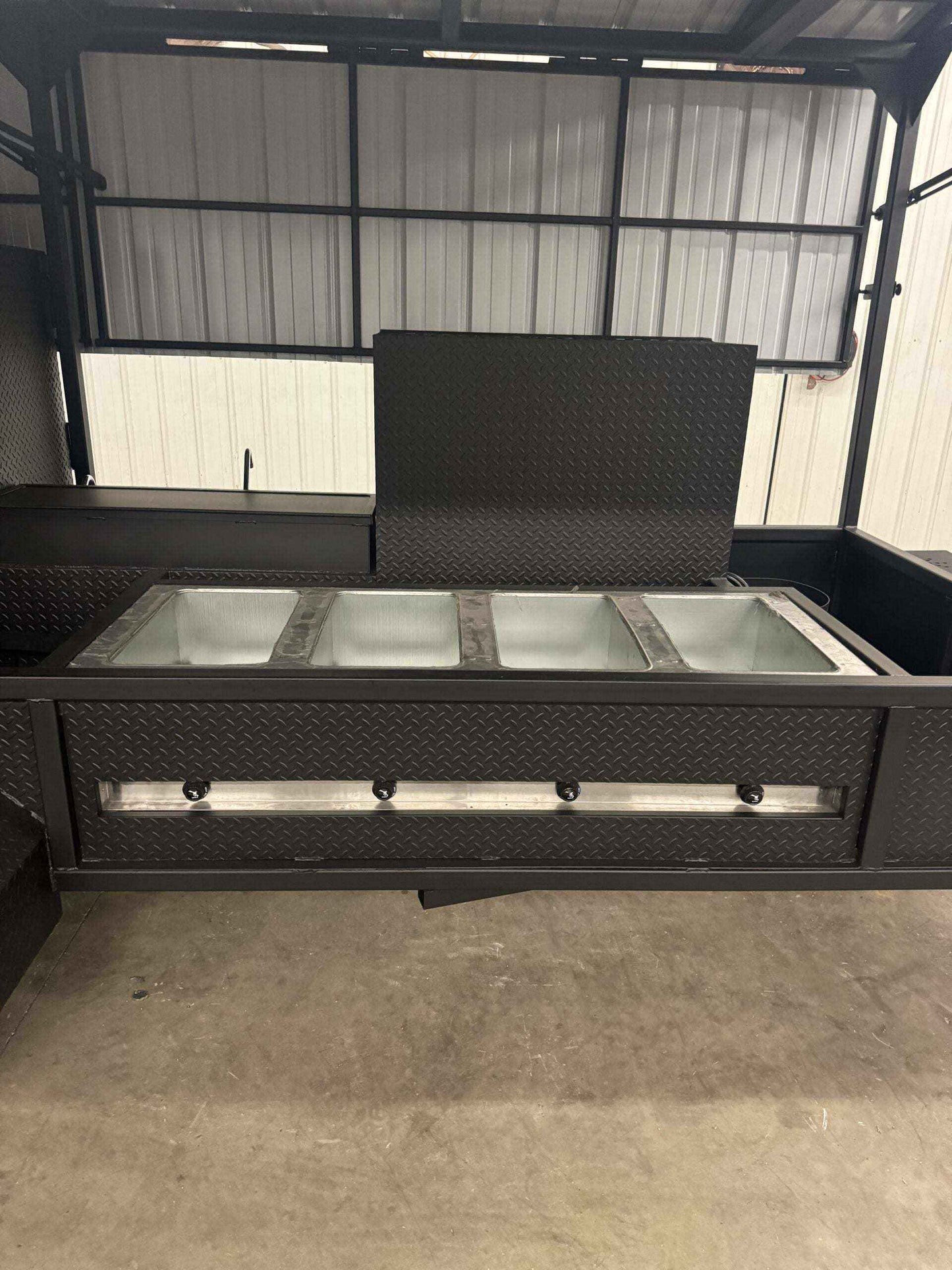 Custom Ultimate Smokehouse 72 commercial smoker with roof, sink package, and griddle insert showing stainless steel sink bays