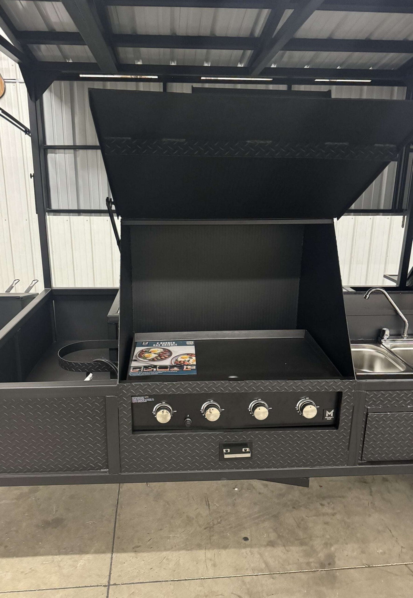 Commercial Smoker Custom Ultimate Smokehouse 72 with 36-inch griddle, four-bay sink, and XL charcoal grill in black diamond tread steel design