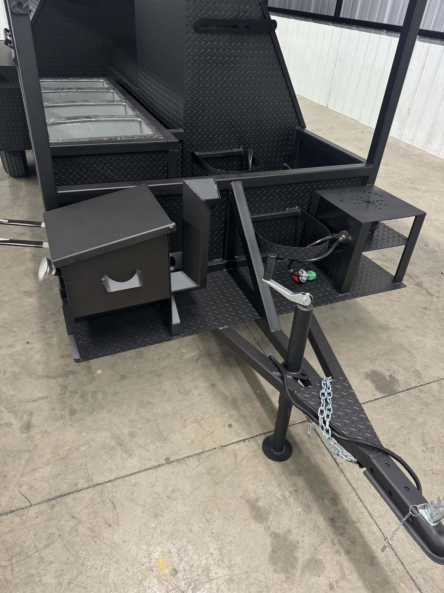 Commercial Smoker Custom Ultimate Smokehouse 72-inch charcoal grill with griddle, multiple cooking racks, insulated firebox, and sink package