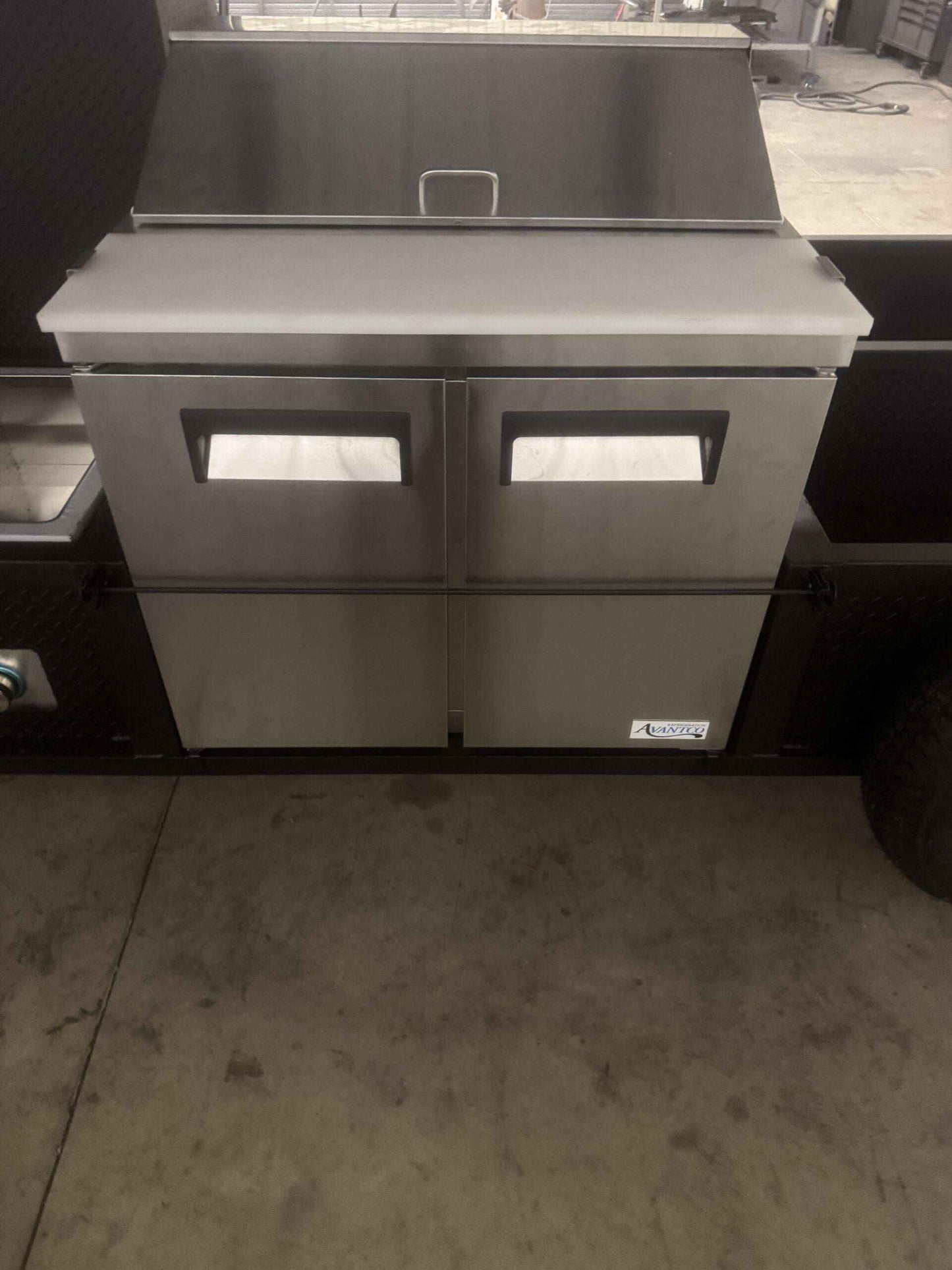 Custom Ultimate Smokehouse 72 smoker trailer with sandwich prep refrigeration and stainless steel sink package