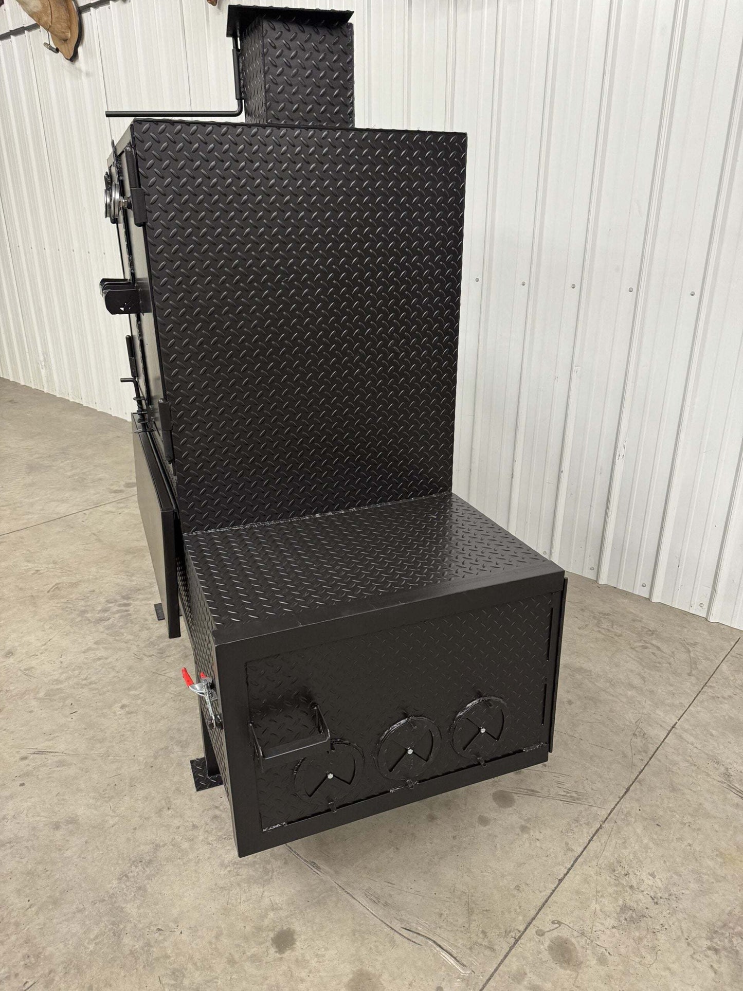 SNS 40 Cabinet Smoker vertical cabinet smoker with large main chamber and insulated firebox in black diamond plate design