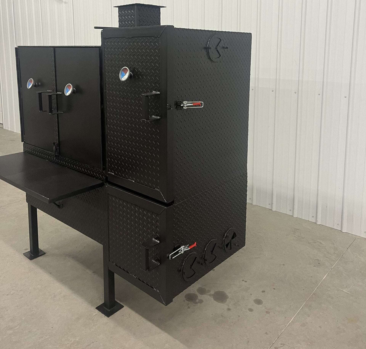 SNS 40 Cabinet vertical smoker with large 30x40 chamber, triple racks, insulated firebox, and heavy-duty construction for high-capacity smoking.