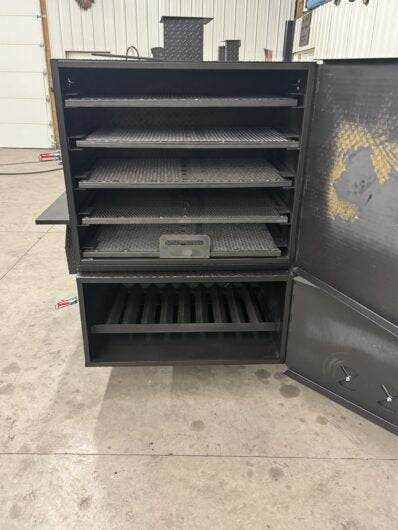 SNS 4060 Cabinet Smoker with multiple slide-out cooking racks and insulated firebox for large capacity smoking and grilling