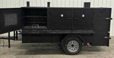 SNS 4060 Cabinet Smoker with cabinet charcoal grill on trailer with multiple cooking racks and firebox opened
