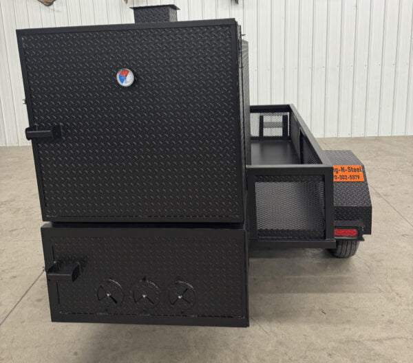Black SNS 4060 smoker grill with diamond tread steel cabinet and insulated firebox on trailer frame