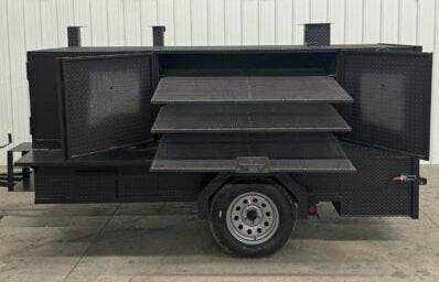 SNS 4060 Smoker grill with cabinet main chamber and slide-out cooking racks on trailer suitable for large-scale catering