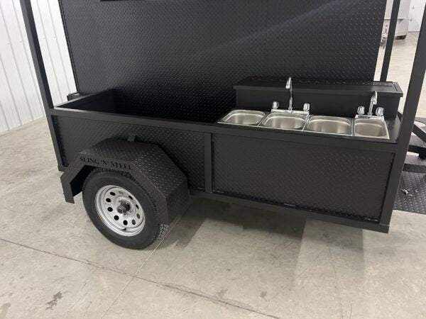SNS 60 Cabinet Smoker and grill combo with sink, fold-down roof, and storage basket on trailer
