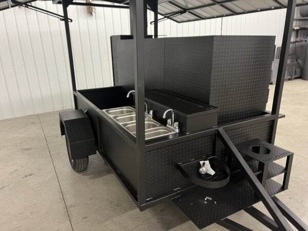 Black SNS 60 commercial smoker cabinet and grill combo trailer with sink and fold-down roof package