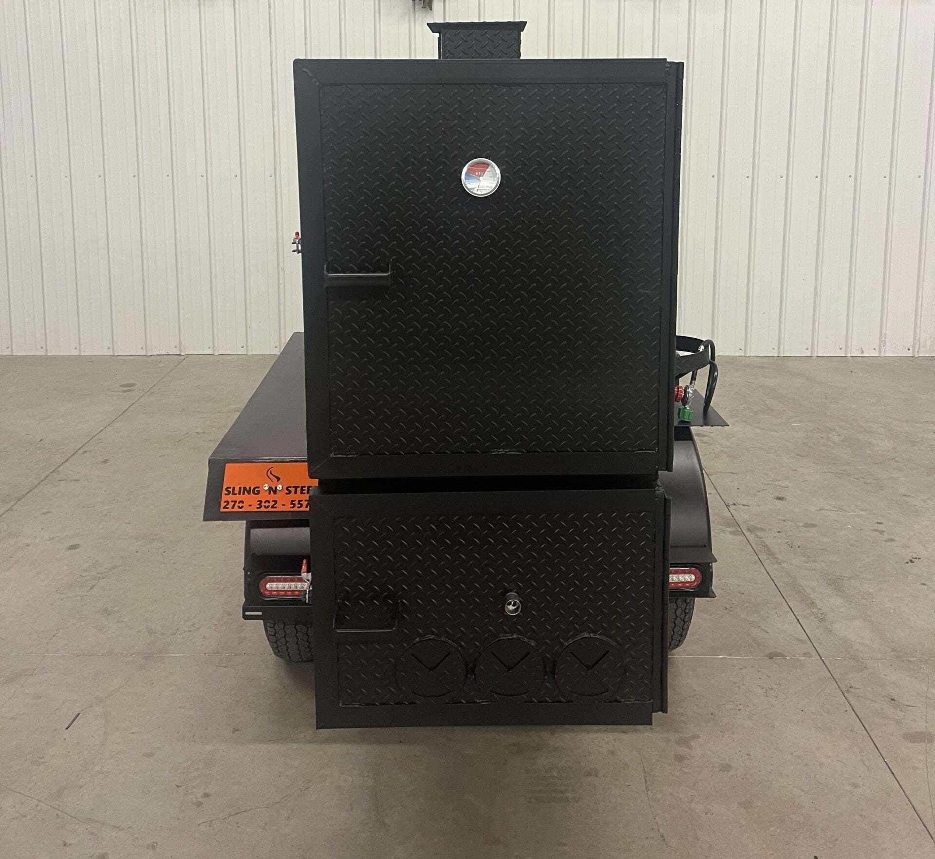 SNS 60 Smoker cabinet trailer with diamond tread steel, insulated firebox, and multiple cooking racks for large capacity barbecue cooking