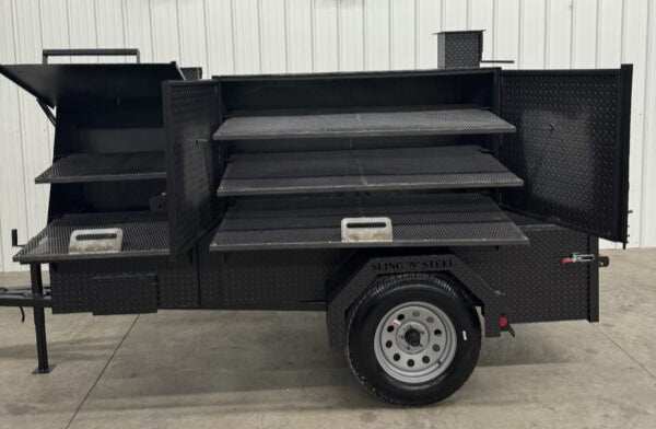 SNS 60 Cabinet smoker and grill trailer with multiple shelves and black textured finish for versatile catering use