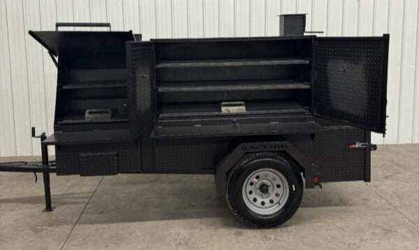 Smoker and Grill SNS 60 Cabinet with charcoal grill and smoker in a mobile trailer for catering events
