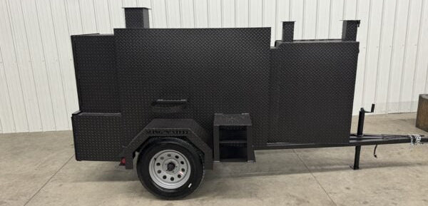 Black SNS 60 Cabinet smoker and grill trailer for versatile catering and smoking