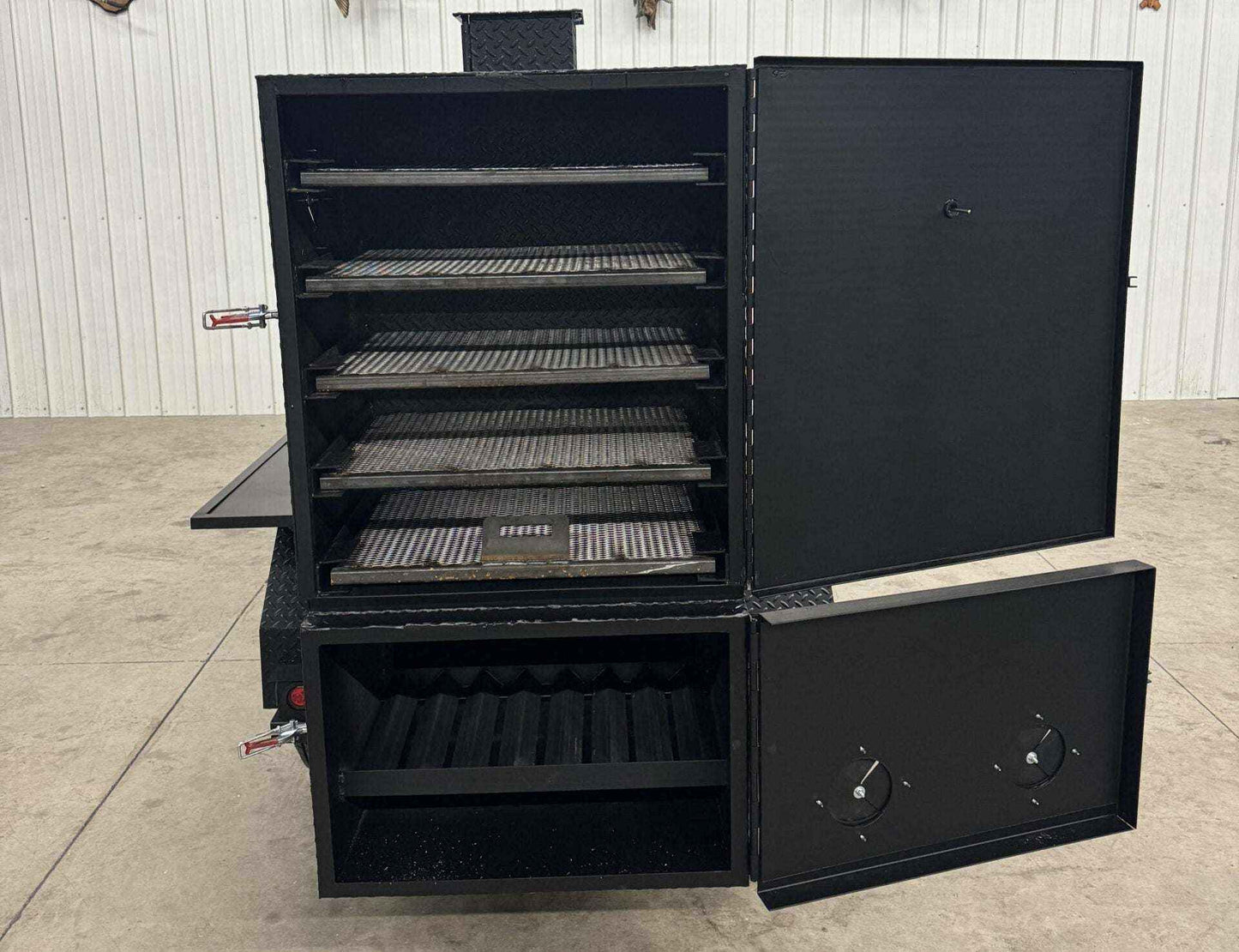 SNS 60 Cabinet smoker with multiple slide-out cooking racks and insulated firebox in black steel design