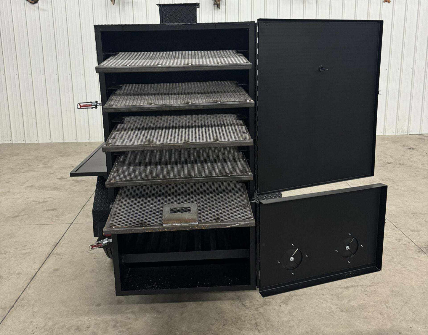 SNS 60 Cabinet smoker with multiple slide-out cooking racks and open black metal doors.