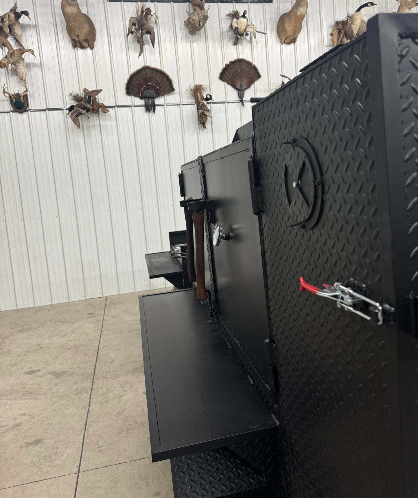 SNS 60 cabinet smoker with sink and deep fryer package made of 1/4 inch diamond tread steel with multiple cooking racks and insulated firebox.