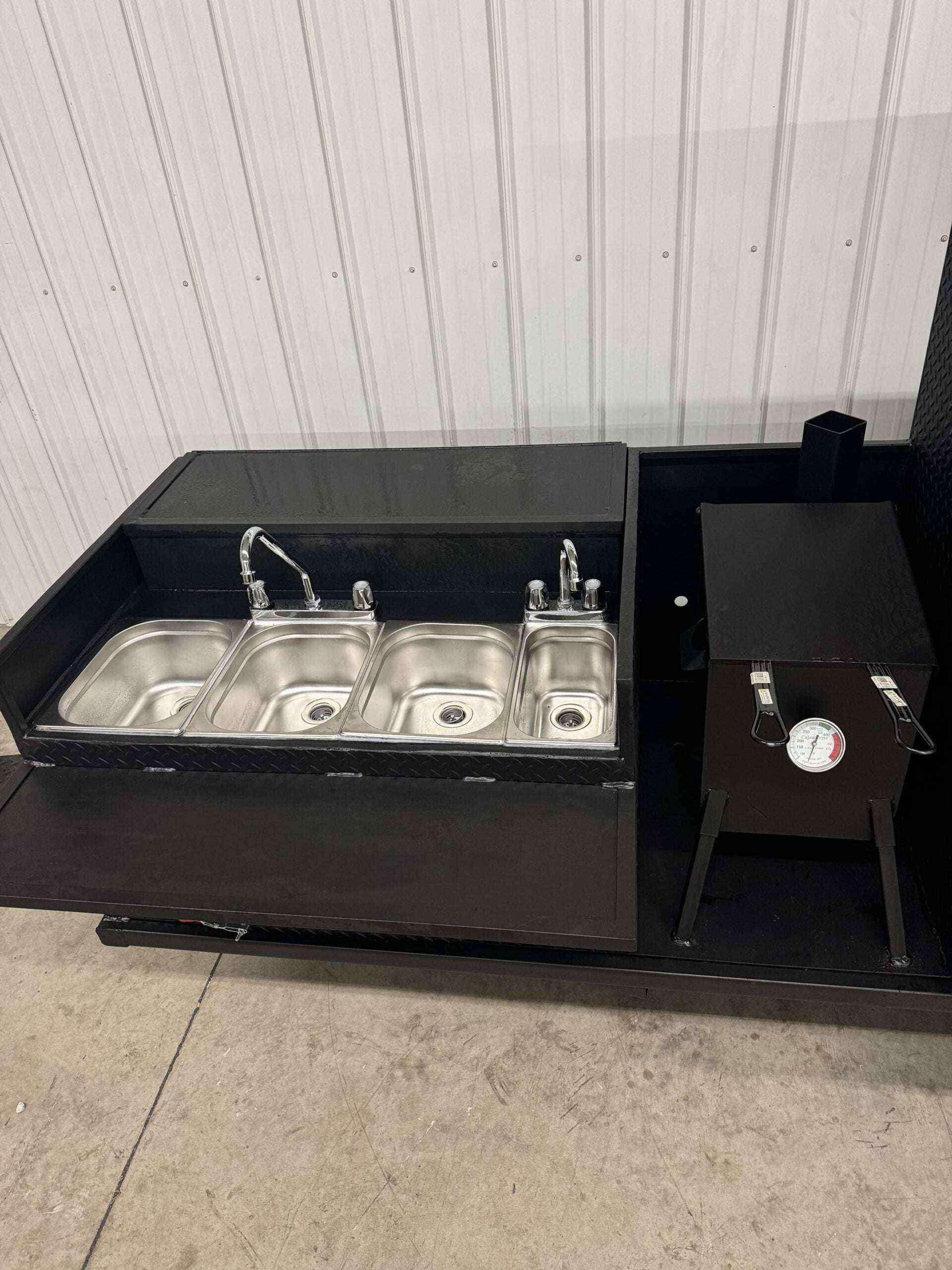 SNS 60 Cabinet with built-in sink and smoker unit featuring triple stainless steel basins and reverse flow firebox smoker