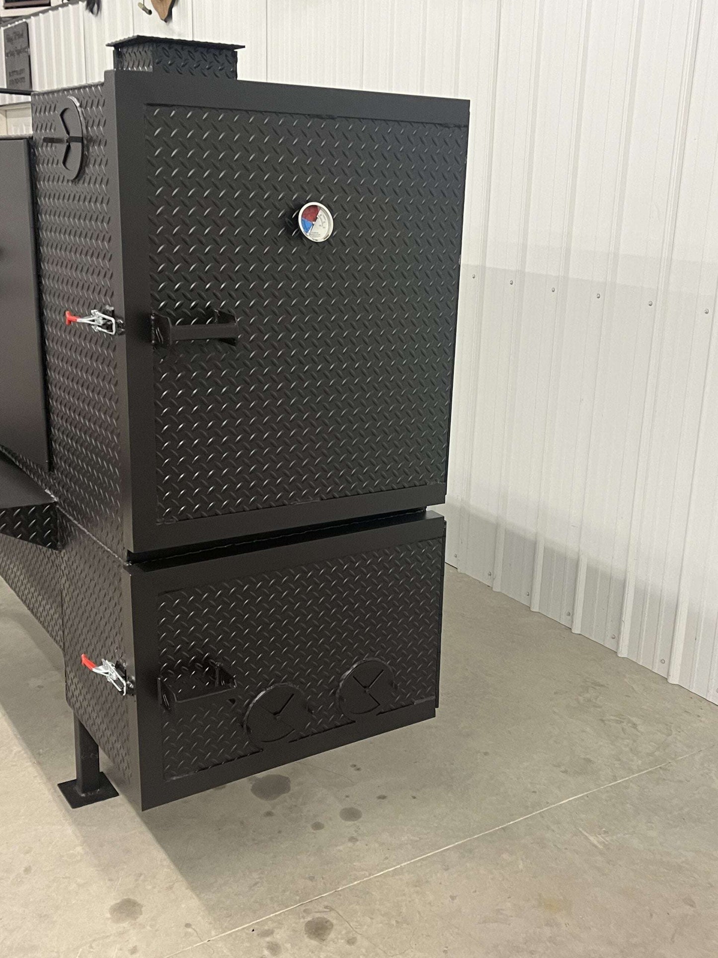60-inch concession smoker cabinet with diamond tread steel, reverse flow design, and multiple cooking racks for high-capacity smoking