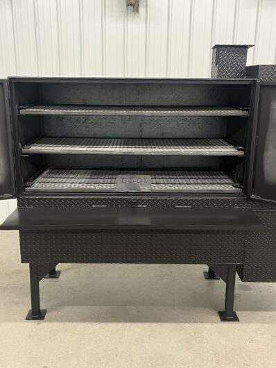 SNS 60 Concession Smoker cabinet with three slide-out cooking racks made of 1/4 inch diamond tread steel, 60"x30" smoker box, insulated firebox, and reverse flow design for commercial use.
