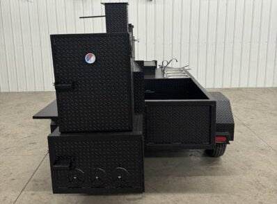 Black offset smoker SNS Barrel 60 catering trailer with sink package and diamond tread steel construction.