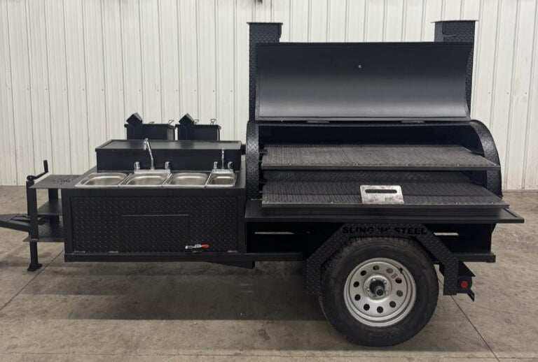 SNS Barrel 60 Charcoal Grill catering trailer with smoker, dual cooking racks, pull-out charcoal tray, fish fryer, and 3-bay sink station
