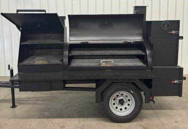 Black SNS Barrel 60 reverse flow smoker and charcoal grill combo on a trailer with insulated firebox, multiple cooking racks, and smoker vents for versatile catering use