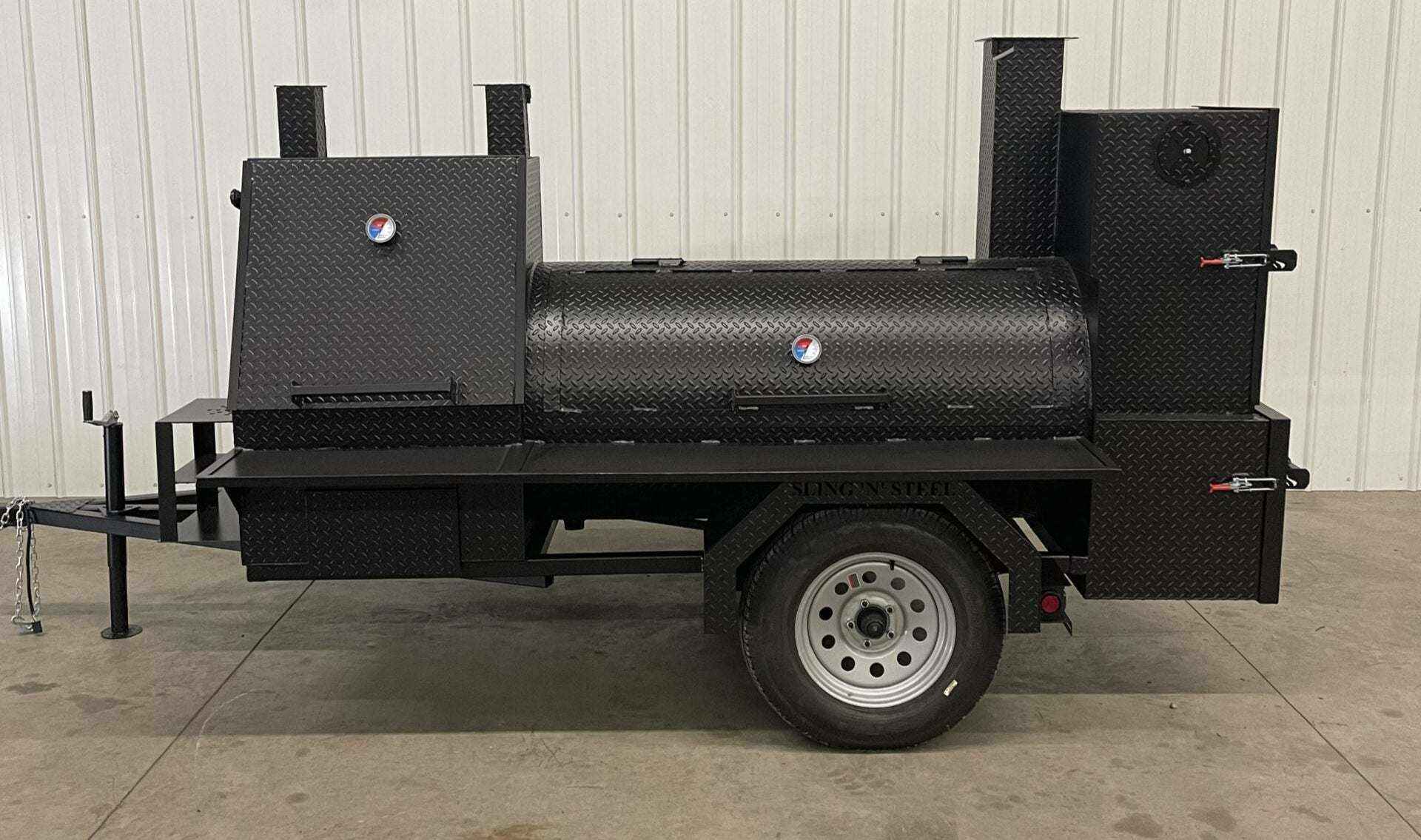 SNS Barrel 60 hog cooker BBQ trailer with grill, full-length storage, and charcoal smoker for catering businesses.