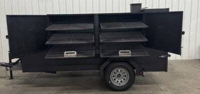 SNS Beast Cabinet Smoker with full length storage, six slide-out cooking racks, insulated firebox, warming box, mounted fish fryer, large storage basket, designed for cooking large quantities of meat.