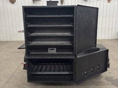 Large black SNS Beast Cabinet Smoker with full-length storage, multiple cooking racks, and insulated firebox for high-capacity smoking.