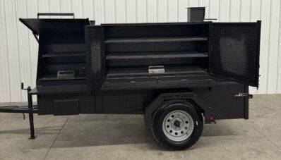 Black SNS Cabinet 60 catering trailer BBQ pit with multiple slide-out cooking racks and storage compartments, designed for versatile outdoor cooking and catering.