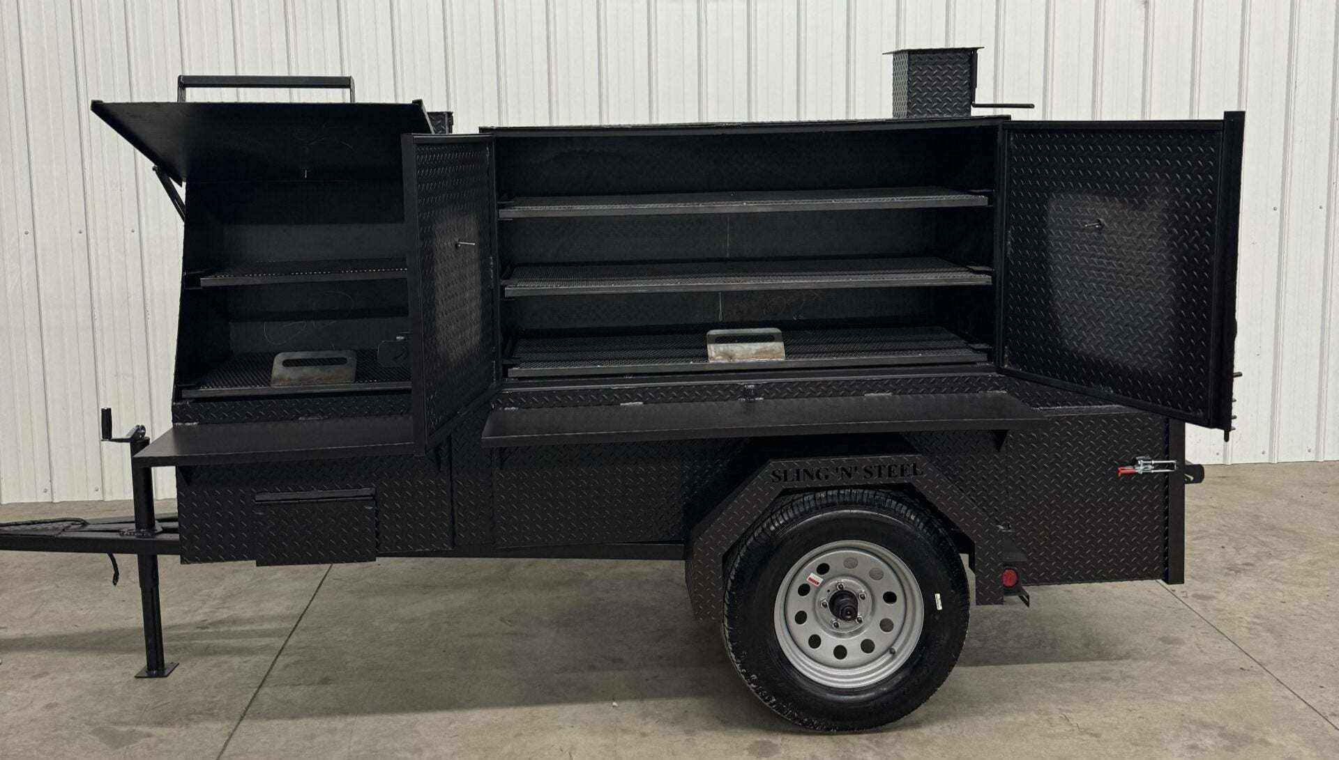 SNS Cabinet 60 Catering Trailer BBQ pit with open cooking racks and charcoal grill in black diamond tread steel
