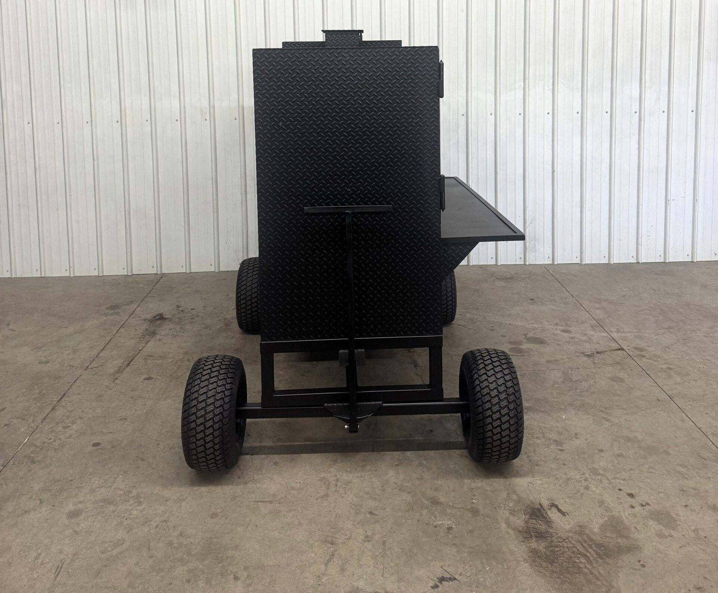 SNS Cabinet 60 Competition Smoker with main cabinet, insulated firebox, rib box, and large wheels for mobility