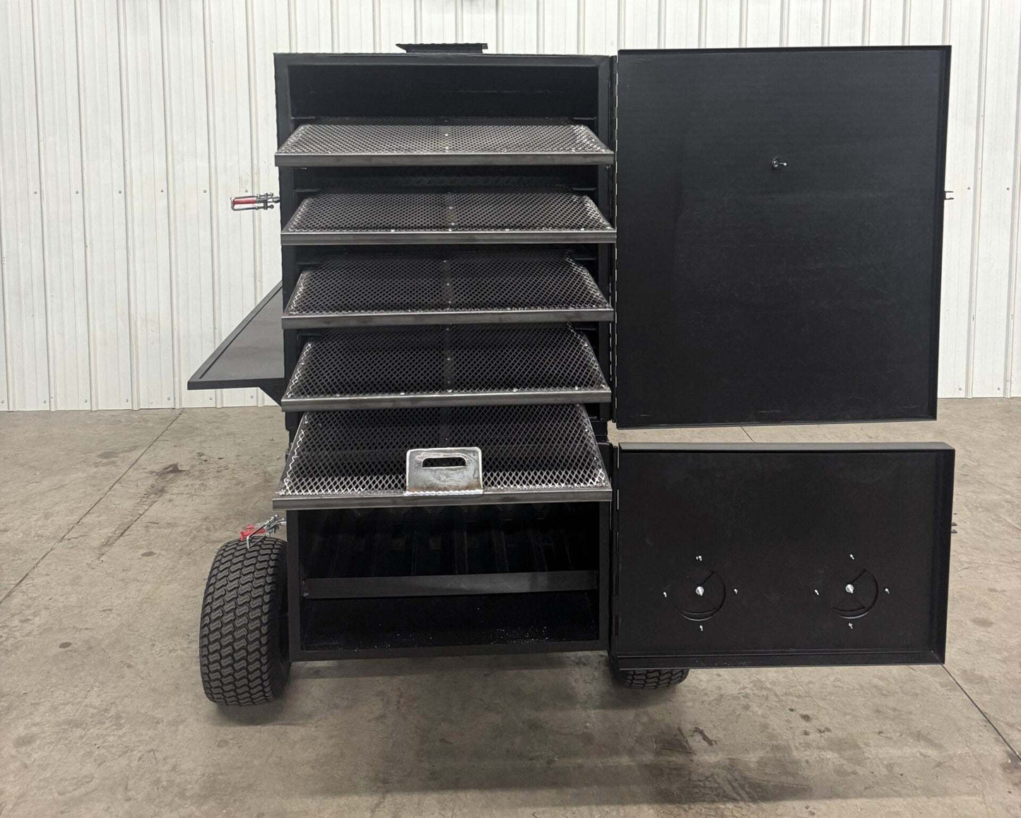 Large black SNS Cabinet 60 Wagon Competition Smoker with multiple slide-out racks and insulated firebox, designed for smoking large quantities of meat.
