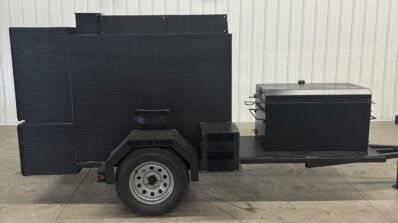 Wood fired smoker SNS Competition 60 Cabinet Smoker and BBQ 42 rotating rack pit on a trailer for commercial catering.