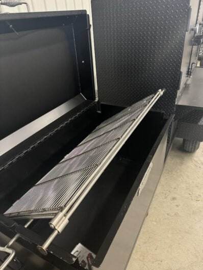 Wood fired smoker SNS Competition 60 Cabinet Smoker with rotating stainless steel cooking rack and large charcoal firebox for commercial BBQ catering