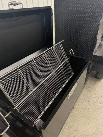 Wood fired smoker SNS Competition 60 Cabinet Smoker with 42-inch rotating stainless steel rack and insulated firebox for commercial BBQ catering.