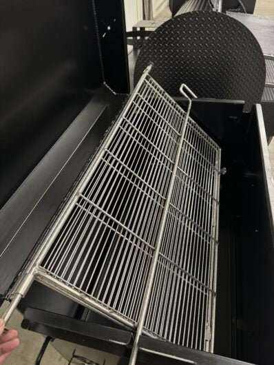 Custom Pits SNS Competition 60 smoker with rotating double-sided stainless steel grate and charcoal pan insert for commercial BBQ catering