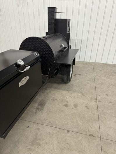 Custom Pits SNS Competition 60 charcoal and wood-fired commercial smoker with rotating stainless steel grate and insulated firebox