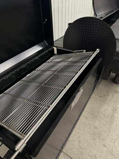 Custom Pits SNS Competition 60 charcoal and wood smoker with rotating stainless steel grill rack and insulated firebox for commercial BBQ catering