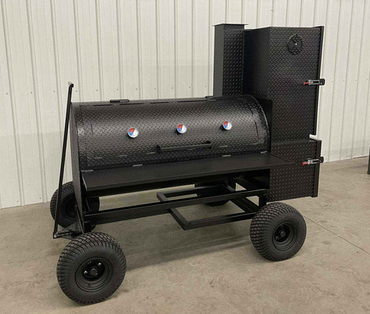 SNS Competition Smoker with large steel tank, insulated firebox, slide-out racks, and large wheels for easy mobility
