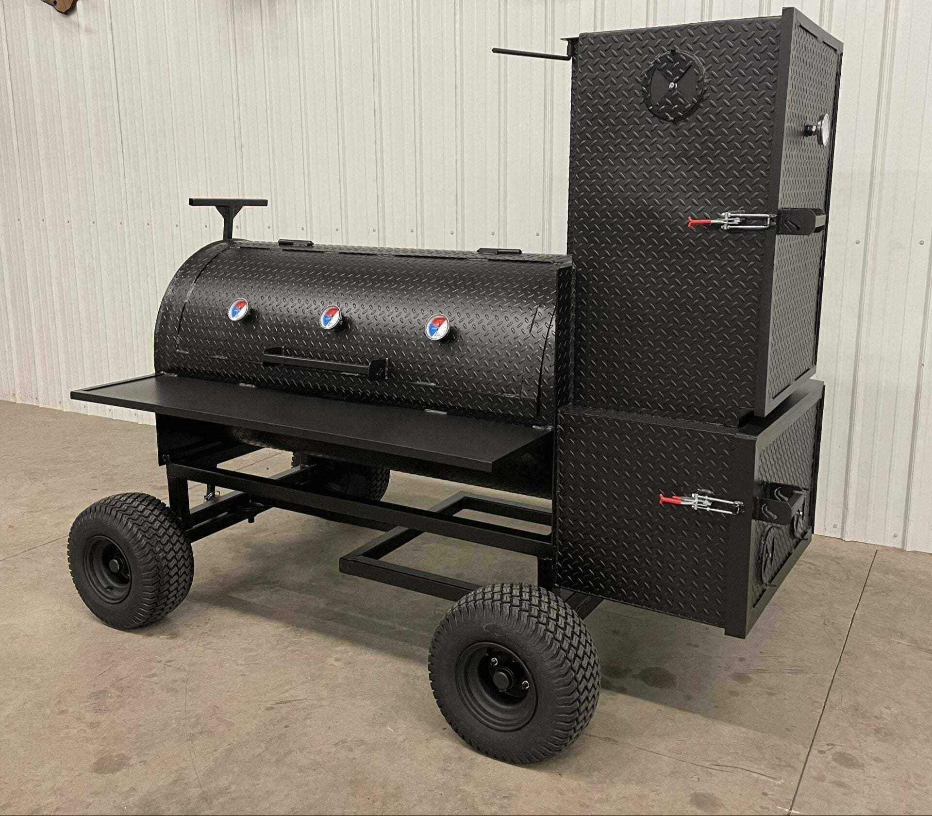 SNS Competition Smoker black steel wagon-style smoker with multiple temperature gauges and large cooking capacity on wheels